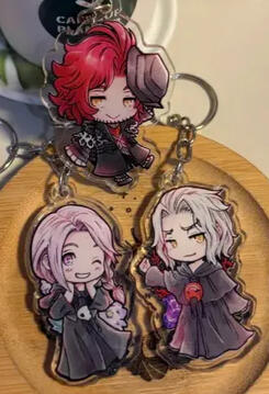 Photo of fanmade acrylic keychain charms of Ardyn Izunia, Hythlodaeus and Hades from Final Fantasy